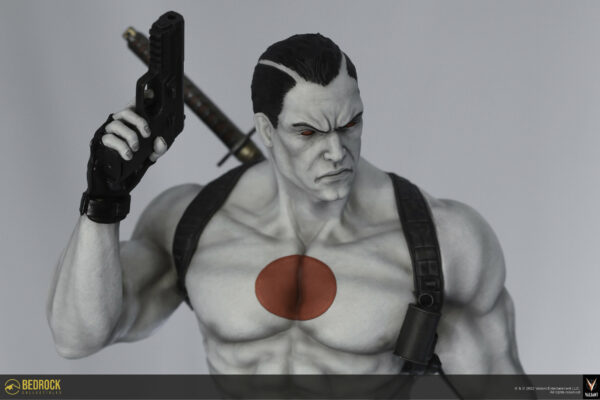 Bloodshot statue pose holding right hand pistol in air in a closeup overhead shot