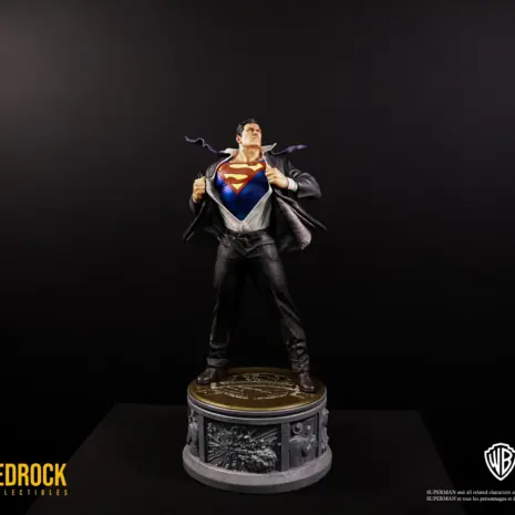 superman-secret-origins-statue-lighting Superman DC Secret Origins Quarter Scale Statue by Bedrock Collectibles. Zoomed out show with lighting of Superman transforming from his work attire at the Daily Planet into his iconic Blue Superman suit with the iconic "S" symbol