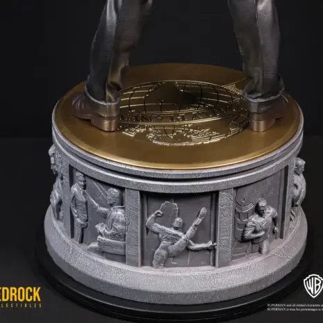 superman-statue-narrative-story-base superman dc secret origins 1/4 scale statue with daily planet medallion and Bedrock's narrative base design. Superman's origin story carved as relief panels